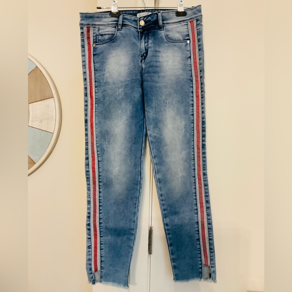 LOTUS Soft Denim Jegging Jeans with side stripes and frayed ankle cutouts .